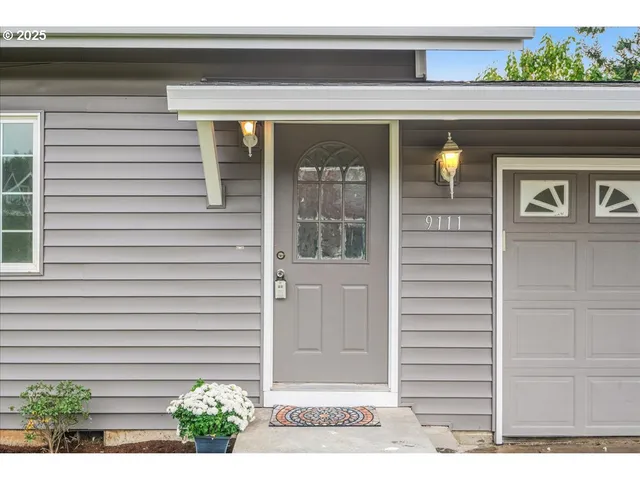 a front view of a house with a garage