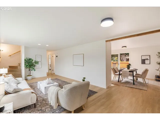 a living room with furniture and a table