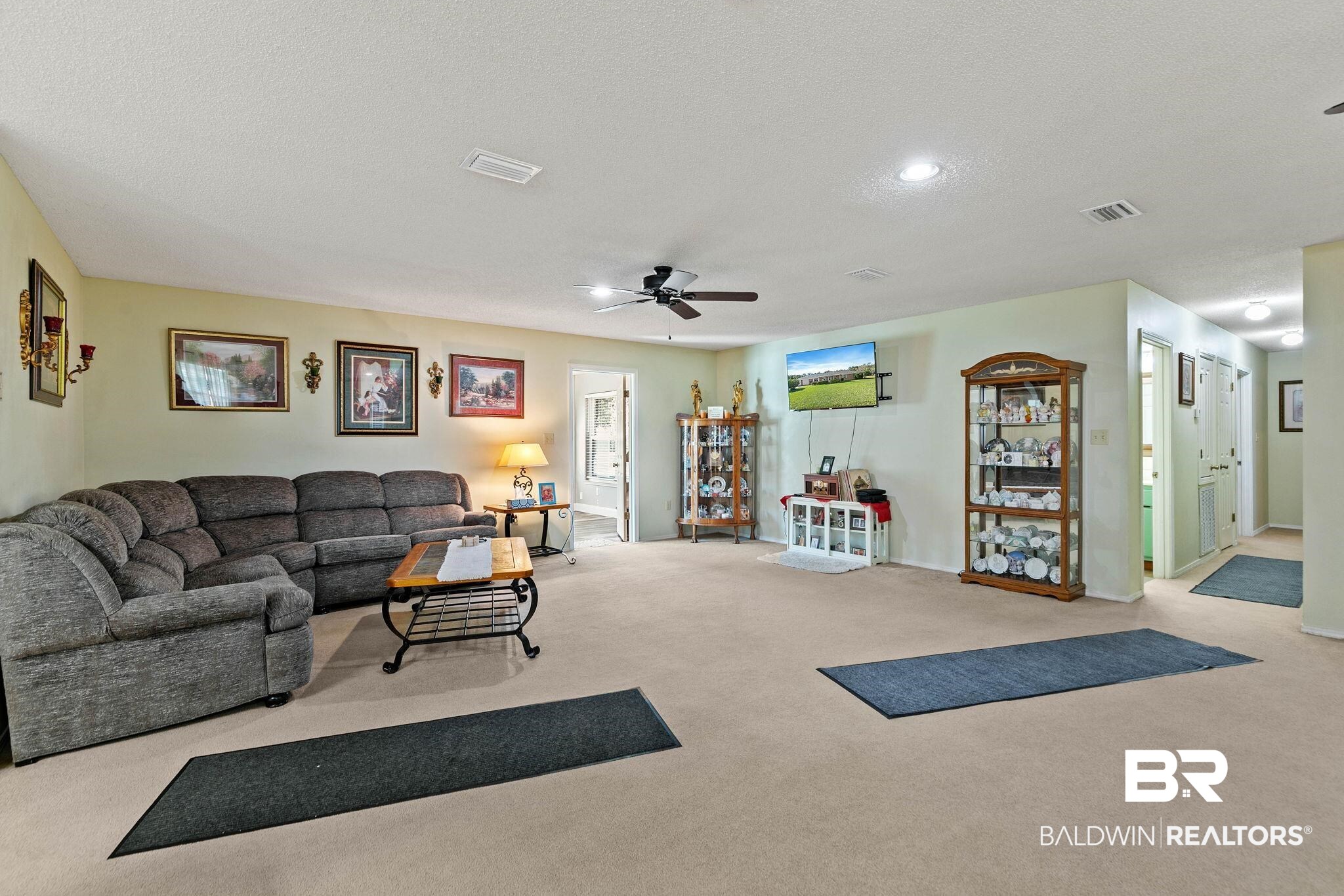 1510 South Juniper Street Foley, AL 36535 - Photo 8 of 36 Living room featuring carpet floors, ceiling fan, a textured ceiling, and recessed lighting