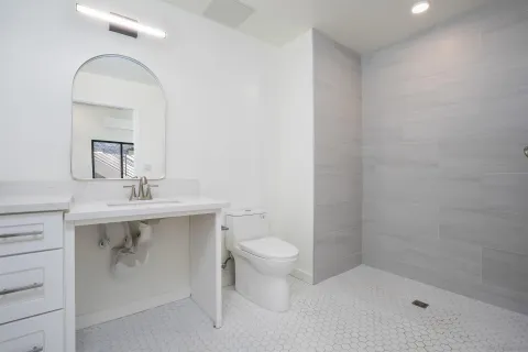 a kitchen with stainless steel appliances a refrigerator stove and microwave