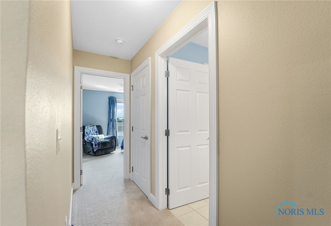 5841 Waterville Monclova Road Waterville, OH 43566 - Photo 27 of 39 The hallway for the two guest bedrooms. There is a full bathroom and a linen closet between the two guest rooms.
