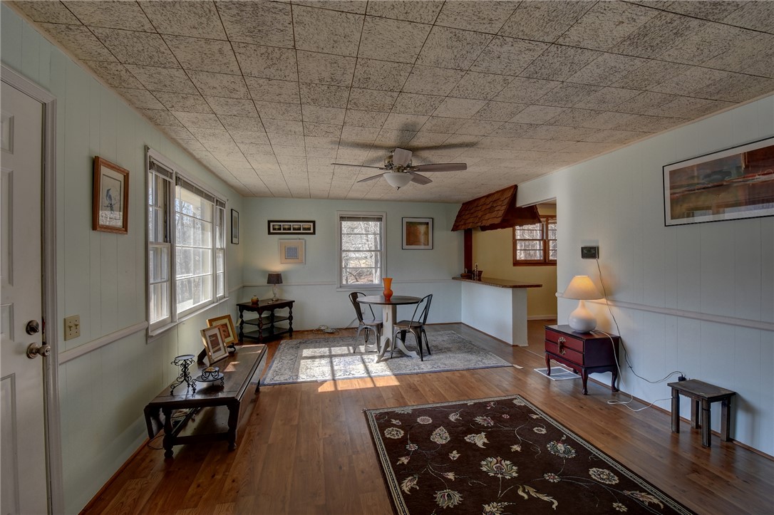 319 Cove Creek Road Pickens, SC 29671 - Photo 11 of 22 This inviting living space features warm hardwood floors and a unique ceiling treatment.