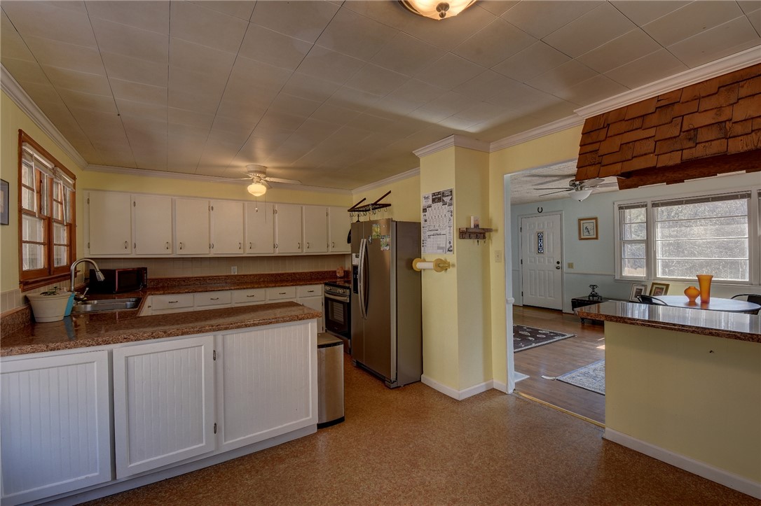 319 Cove Creek Road Pickens, SC 29671 - Photo 11 of 20 This spacious kitchen offers ample cabinetry and counter space, perfect for any home chef.