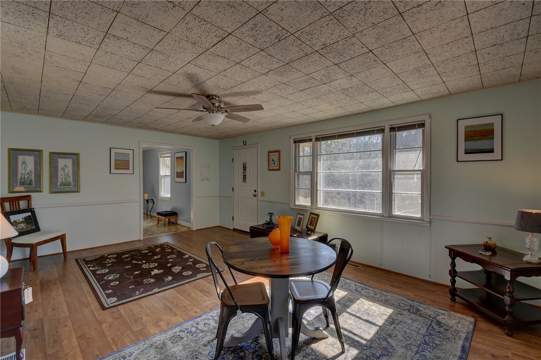 319 Cove Creek Road Pickens, SC 29671 - Photo 13 of 22 This inviting space features warm wood flooring, ample natural light, and classic architectural details.