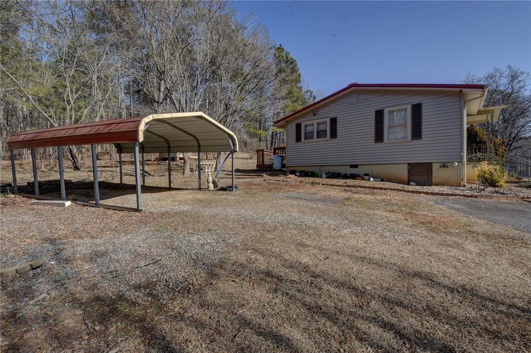 319 Cove Creek Road Pickens, SC 29671 - Photo 5 of 22 This charming residence offers a peaceful retreat with practical outdoor amenities.