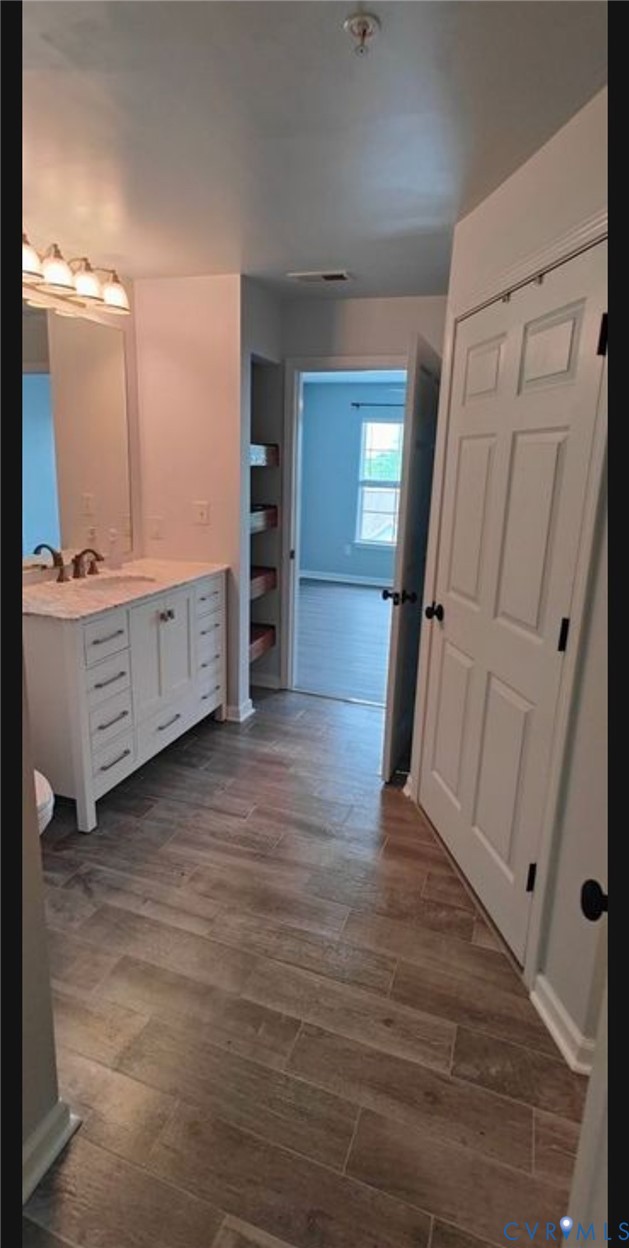 600 Fern Meadow Loop, Unit 304 Midlothian, VA 23114 - Photo 11 of 12 Bathroom featuring vanity and dark wood finished f