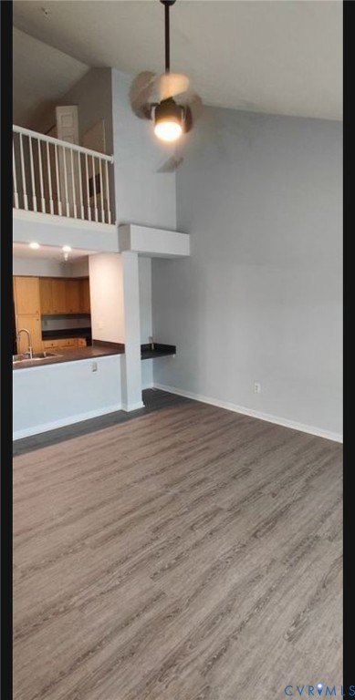 600 Fern Meadow Loop, Unit 304 Midlothian, VA 23114 - Photo 2 of 12 Unfurnished living room featuring dark wood-style