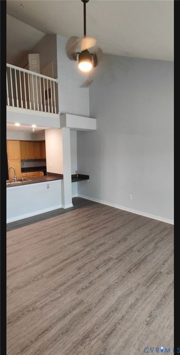 600 Fern Meadow Loop, Unit 304 Midlothian, VA 23114 - Photo 2 of 12 Unfurnished living room featuring dark wood-style