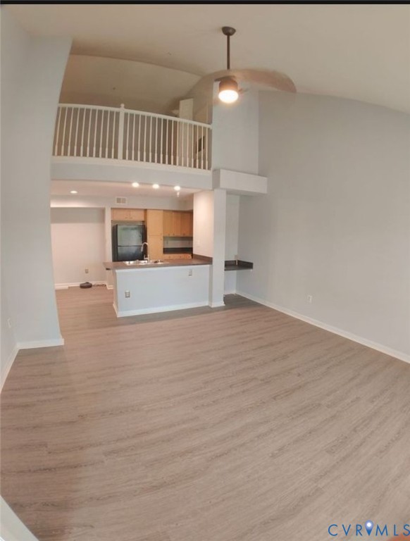 600 Fern Meadow Loop, Unit 304 Midlothian, VA 23114 - Photo 4 of 12 Unfurnished living room with light wood-style floo