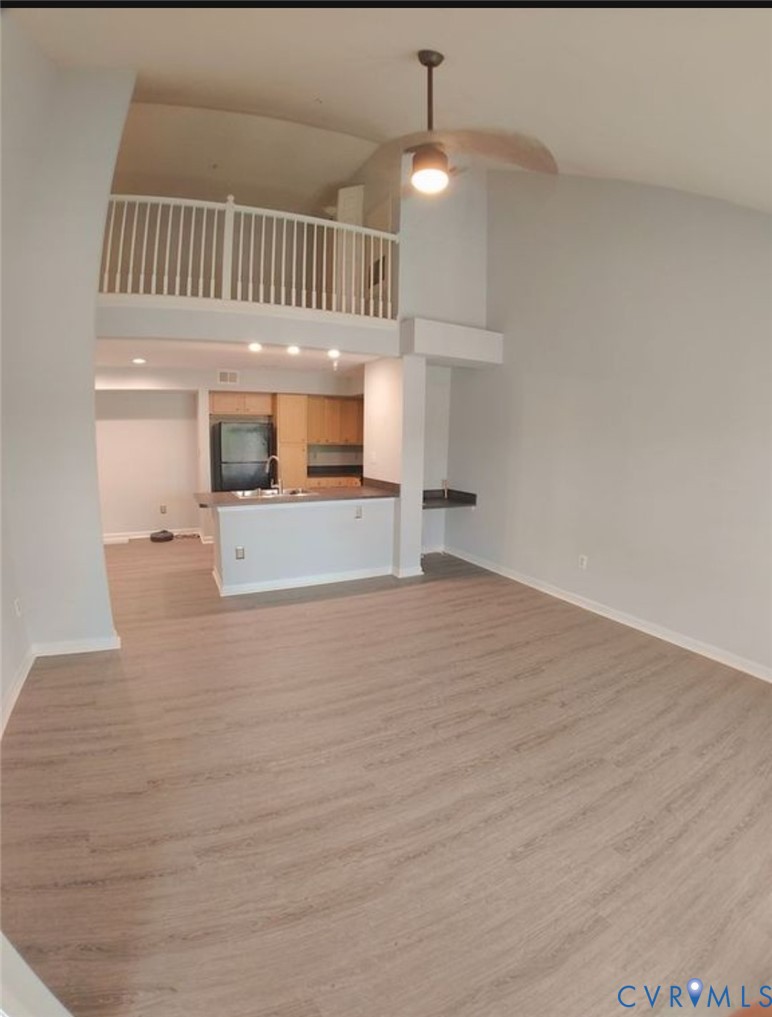 600 Fern Meadow Loop, Unit 304 Midlothian, VA 23114 - Photo 4 of 12 Unfurnished living room with light wood-style floo