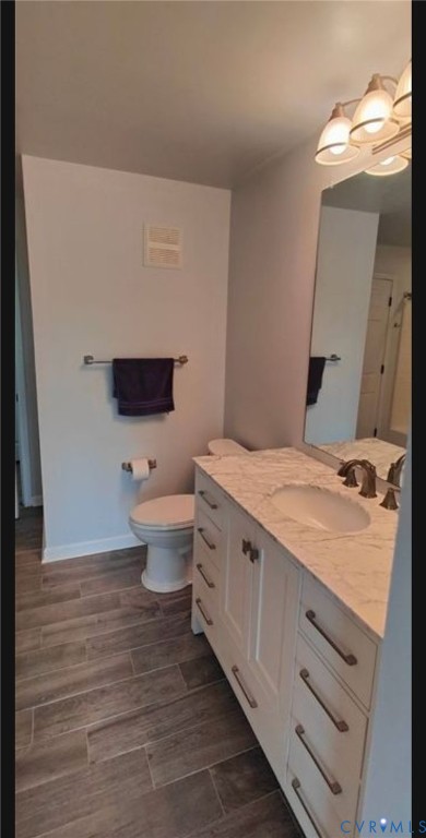 600 Fern Meadow Loop, Unit 304 Midlothian, VA 23114 - Photo 6 of 12 Bathroom with vanity and wood finish floors