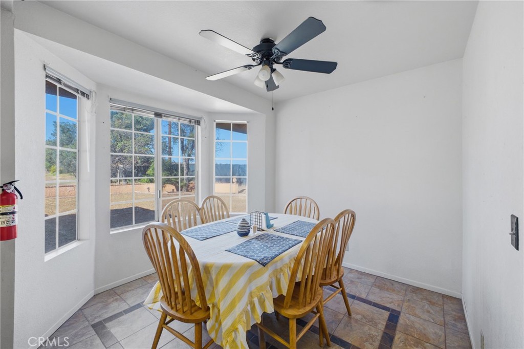 19992 Covell Street Riverside, CA 92508 - Photo 19 of 57 a view of a dining room with furniture window and wooden floor