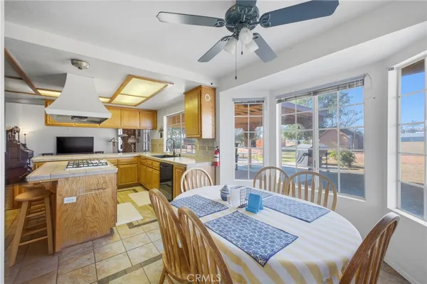 a kitchen with a table and chairs