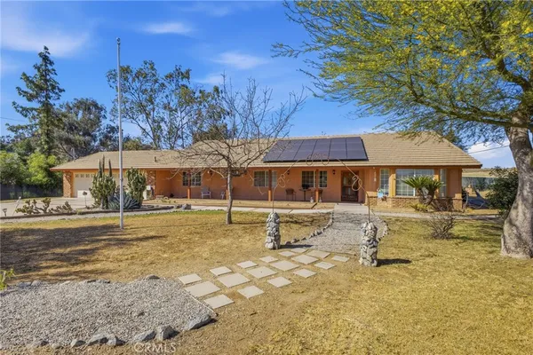 a swimming pool with outdoor seating and yard