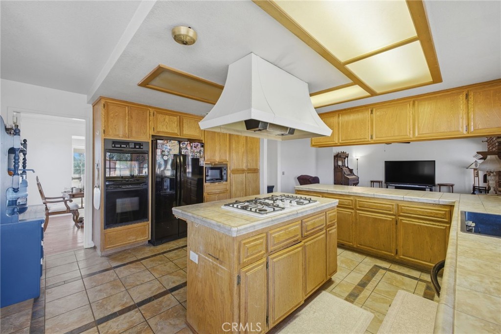 19992 Covell Street Riverside, CA 92508 - Photo 21 of 57 a kitchen that has a stove and a microwave