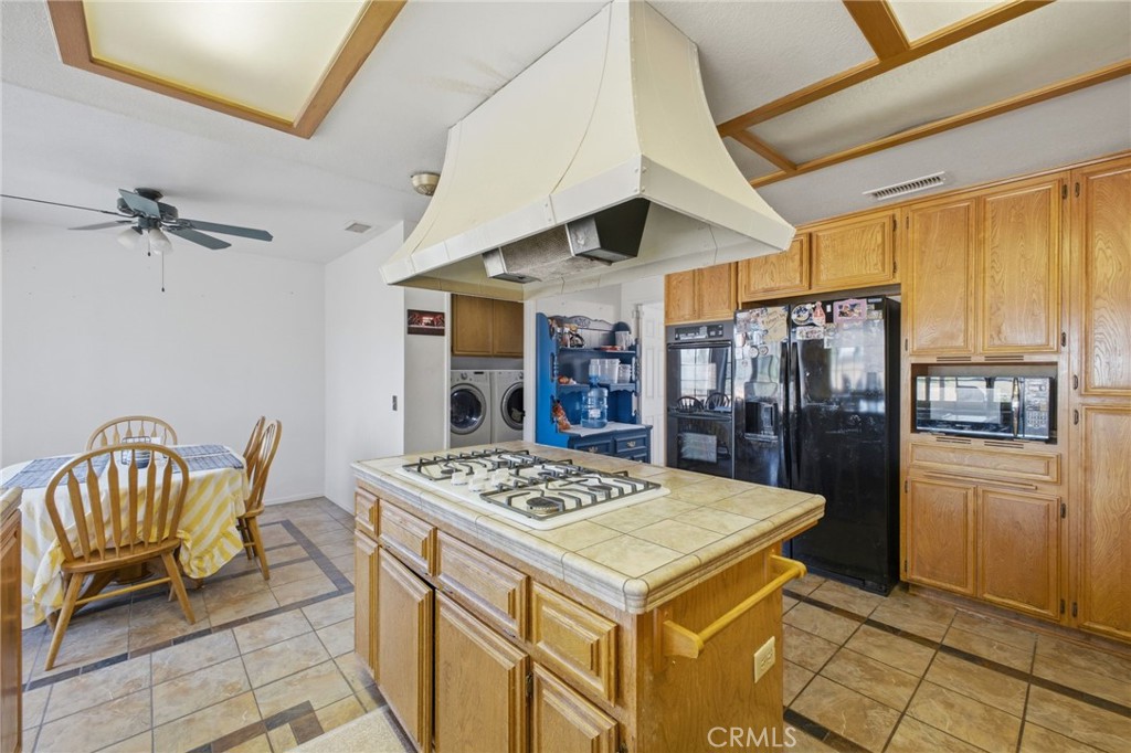 19992 Covell Street Riverside, CA 92508 - Photo 22 of 57 a kitchen with a table and chairs