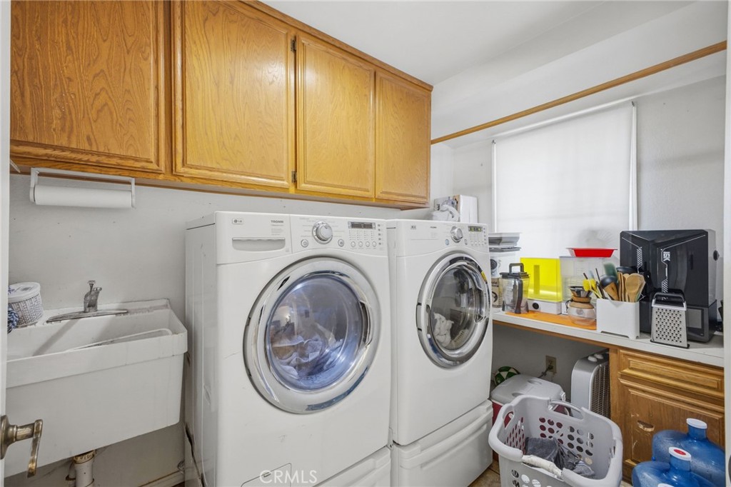 19992 Covell Street Riverside, CA 92508 - Photo 23 of 57 a utility room with sink dryer and washer