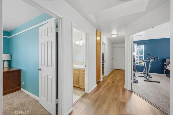 a spacious bathroom with a toilet sink and mirror