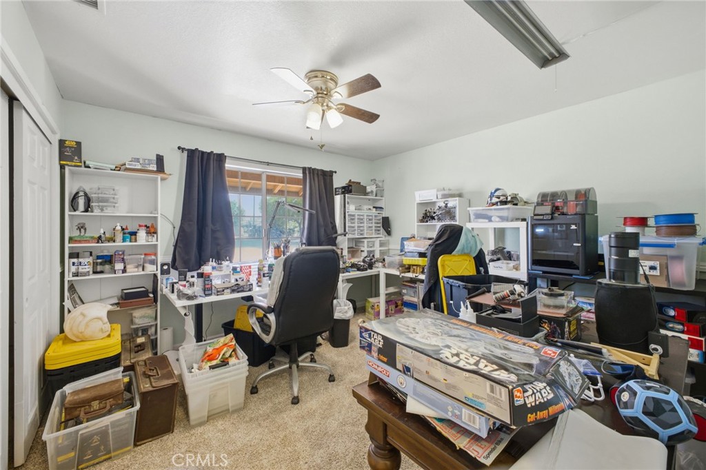 19992 Covell Street Riverside, CA 92508 - Photo 38 of 57 a view of a workspace with furniture and a window