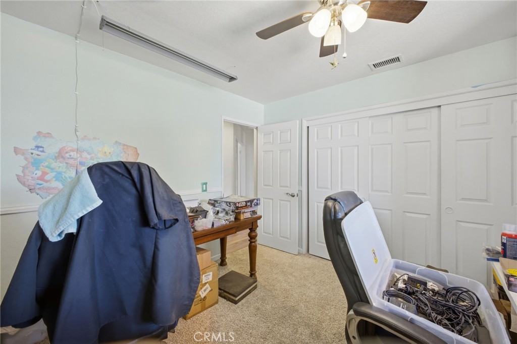 19992 Covell Street Riverside, CA 92508 - Photo 39 of 57 a view of a workspace with furniture and a window