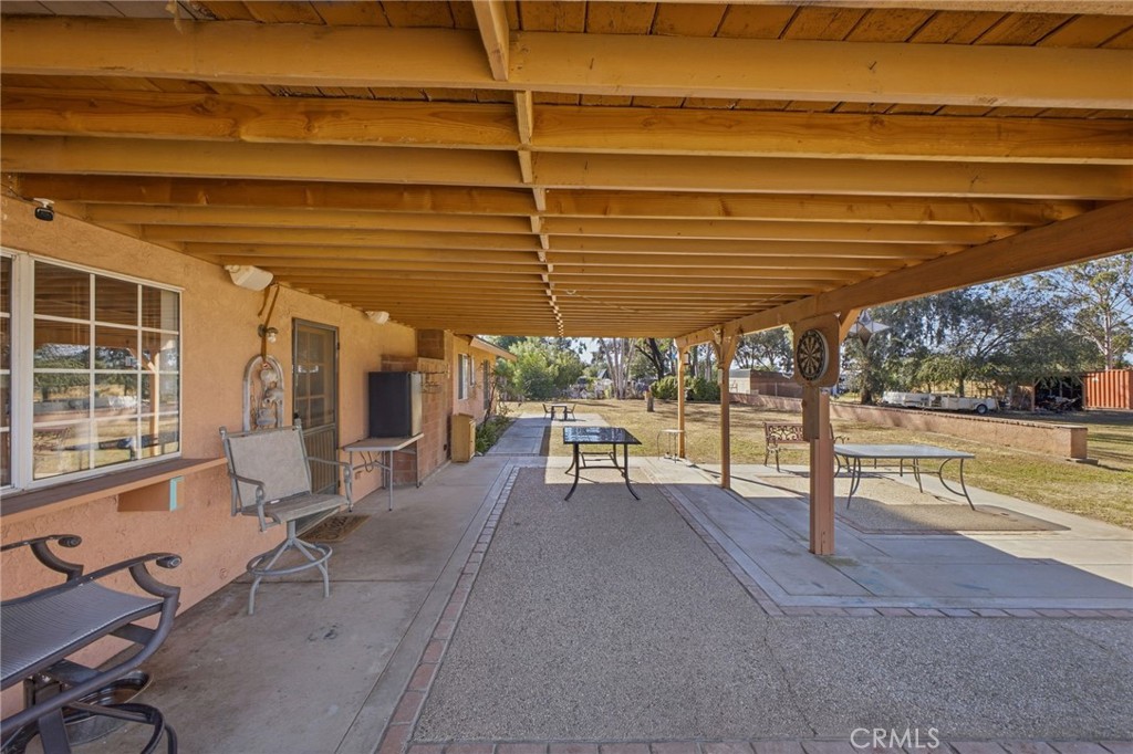 19992 Covell Street Riverside, CA 92508 - Photo 42 of 57 a view of a patio with table and chairs near a barbeque