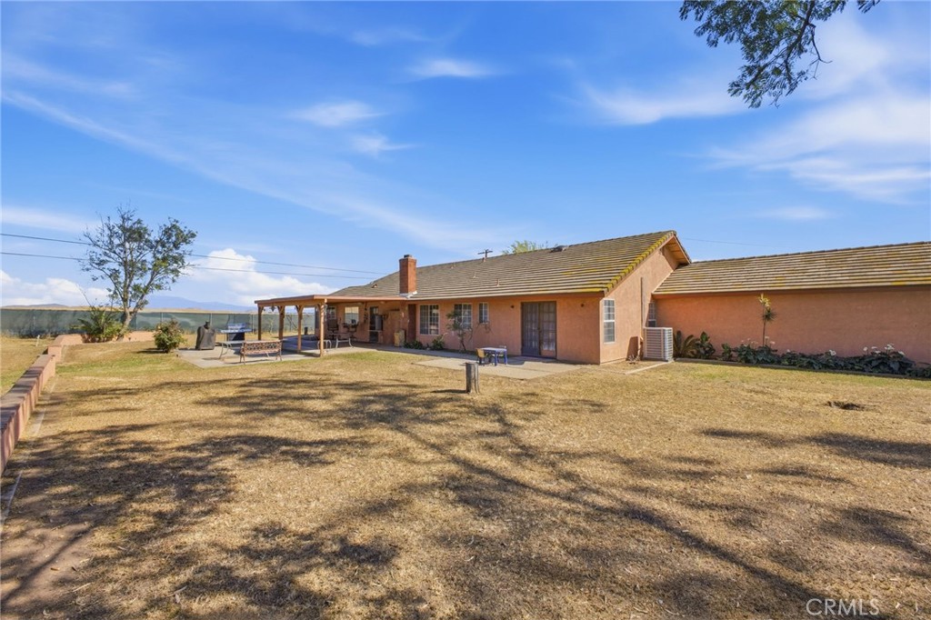19992 Covell Street Riverside, CA 92508 - Photo 46 of 57 a swimming pool with outdoor seating and yard