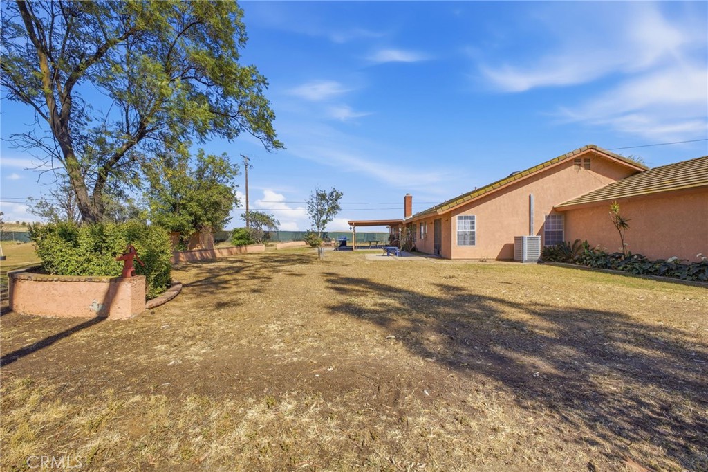 19992 Covell Street Riverside, CA 92508 - Photo 48 of 57 a yellow house with trees in front of it