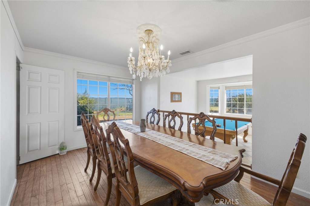 19992 Covell Street Riverside, CA 92508 - Photo 9 of 57 a view of a dining room with furniture window and wooden floor