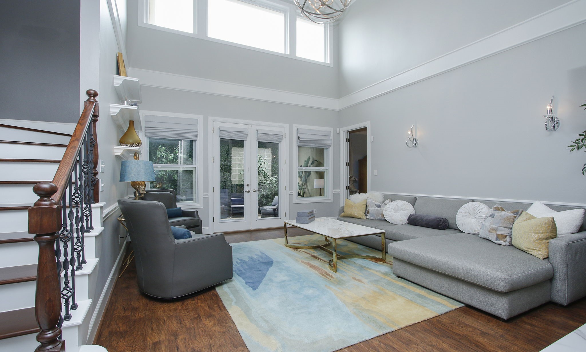 16610 Manningtree Lane Spring, TX 77379 - Photo 8 of 50 The two story family room is stunning with luxury laminated flooring and wall of windows.