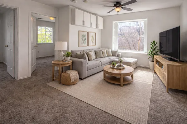 a living room with furniture and a flat screen tv