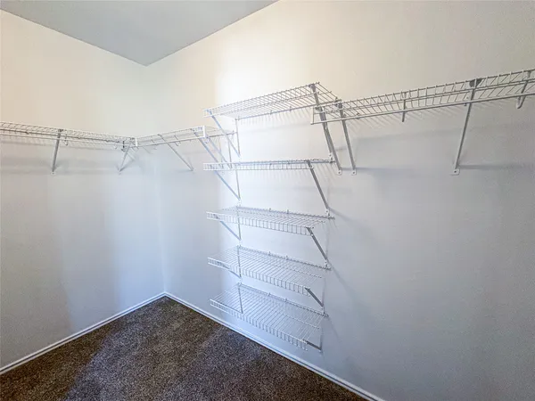 a view of a room with racks on the wall
