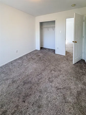 a view of an empty room and entryway