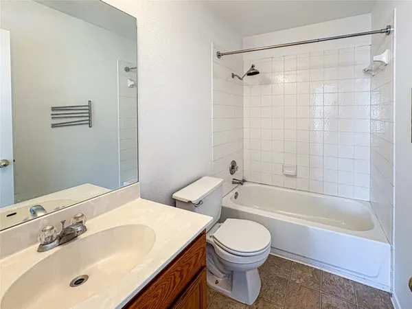 a bathroom with a sink a toilet and a bathtub