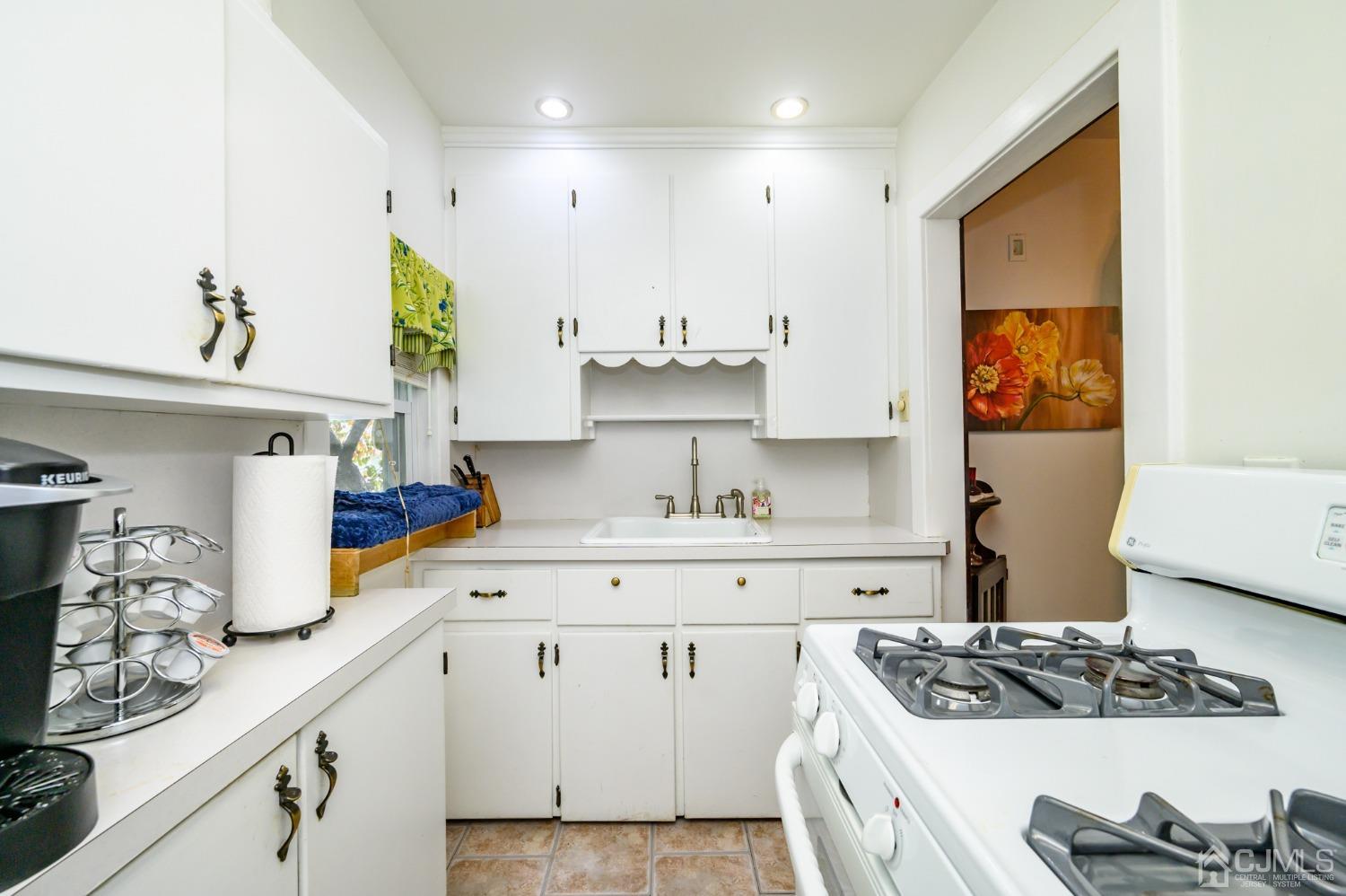 1860 Pennington Road Ewing, NJ 08638 - Photo 13 of 35 a kitchen with stainless steel appliances granite countertop a sink stove and cabinets