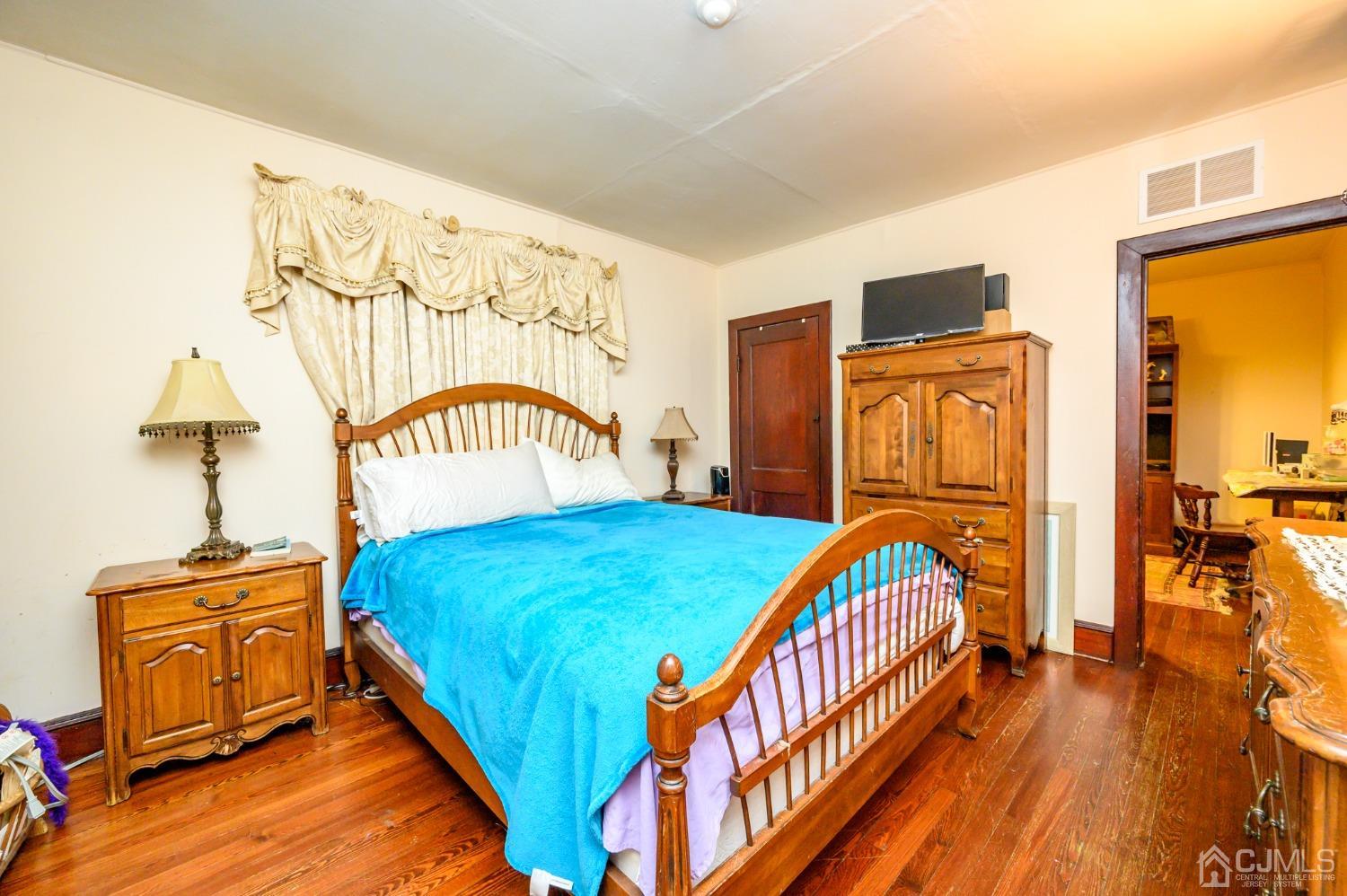 1860 Pennington Road Ewing, NJ 08638 - Photo 19 of 35 a bed sitting in a bedroom next to a window