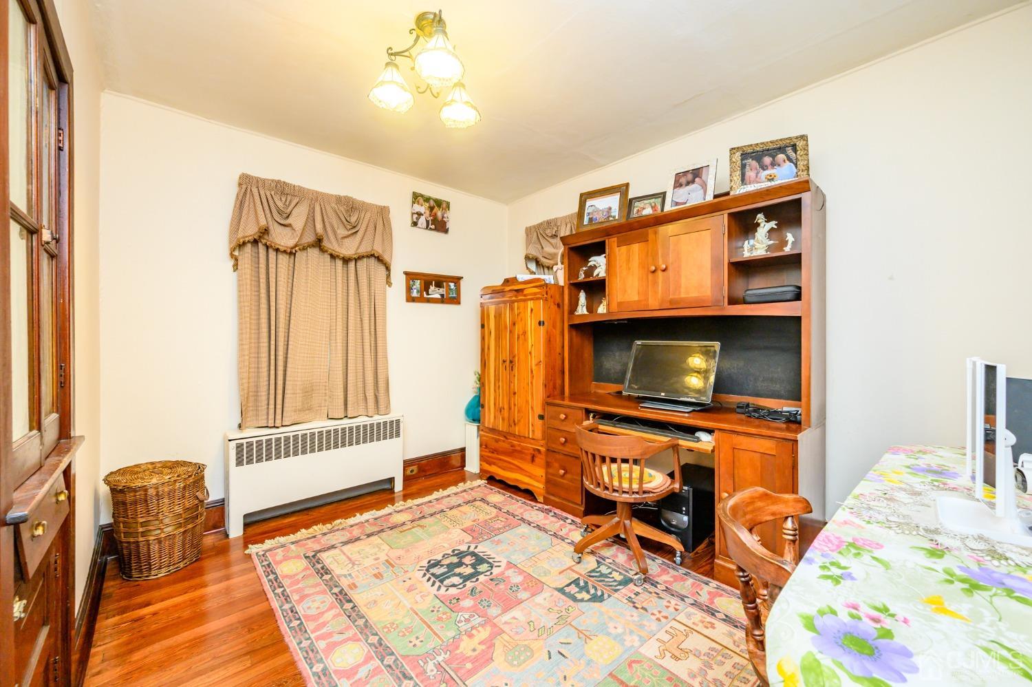1860 Pennington Road Ewing, NJ 08638 - Photo 20 of 35 a bedroom with furniture and a flat screen tv