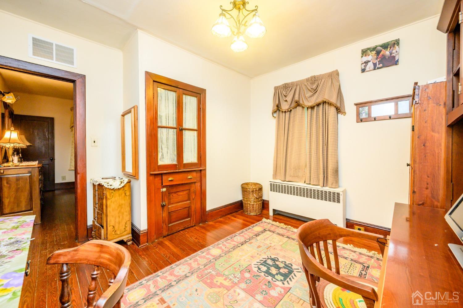 1860 Pennington Road Ewing, NJ 08638 - Photo 21 of 35 a bedroom with a bed and a dresser next to a window