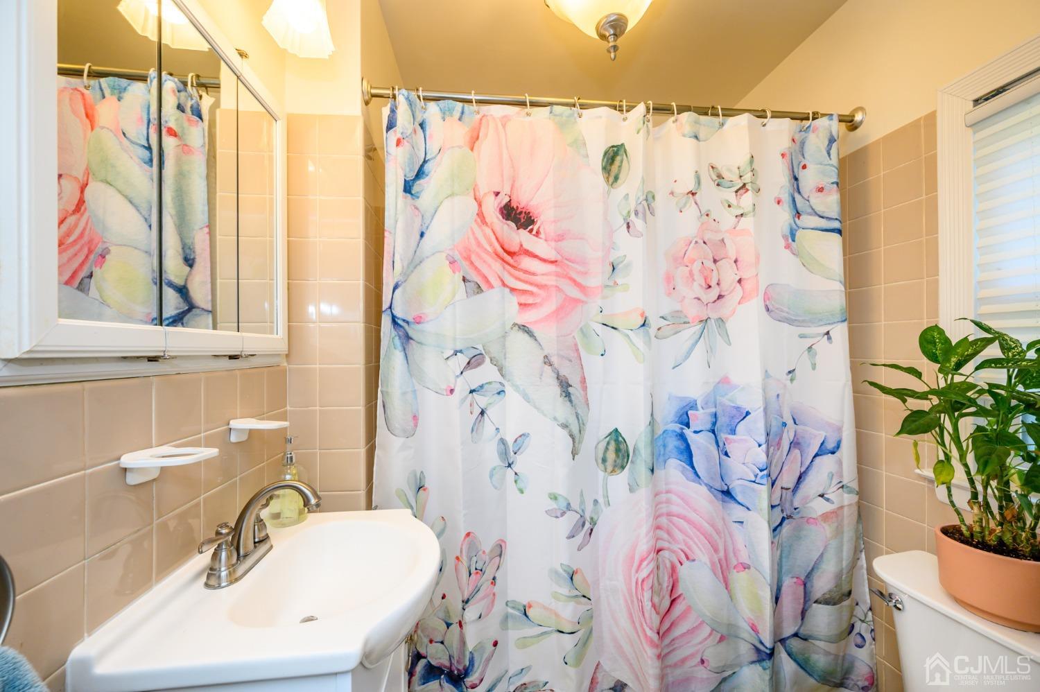 1860 Pennington Road Ewing, NJ 08638 - Photo 23 of 35 a bathroom with a sink and a mirror