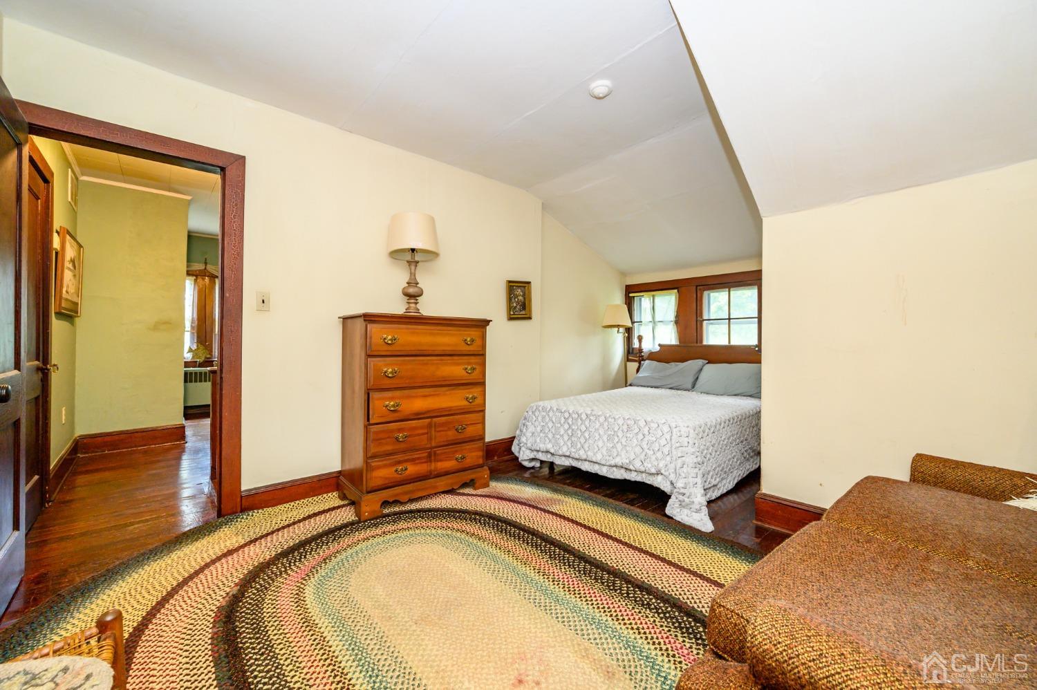 1860 Pennington Road Ewing, NJ 08638 - Photo 29 of 35 a bedroom with a bed and dresser with mirror