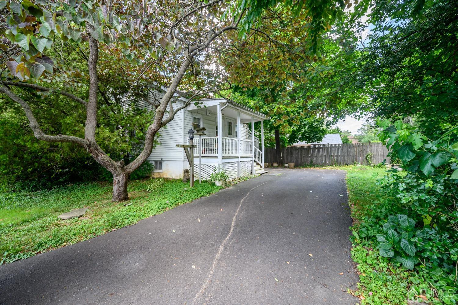 1860 Pennington Road Ewing, NJ 08638 - Photo 35 of 35 a front view of a house with a yard and trees