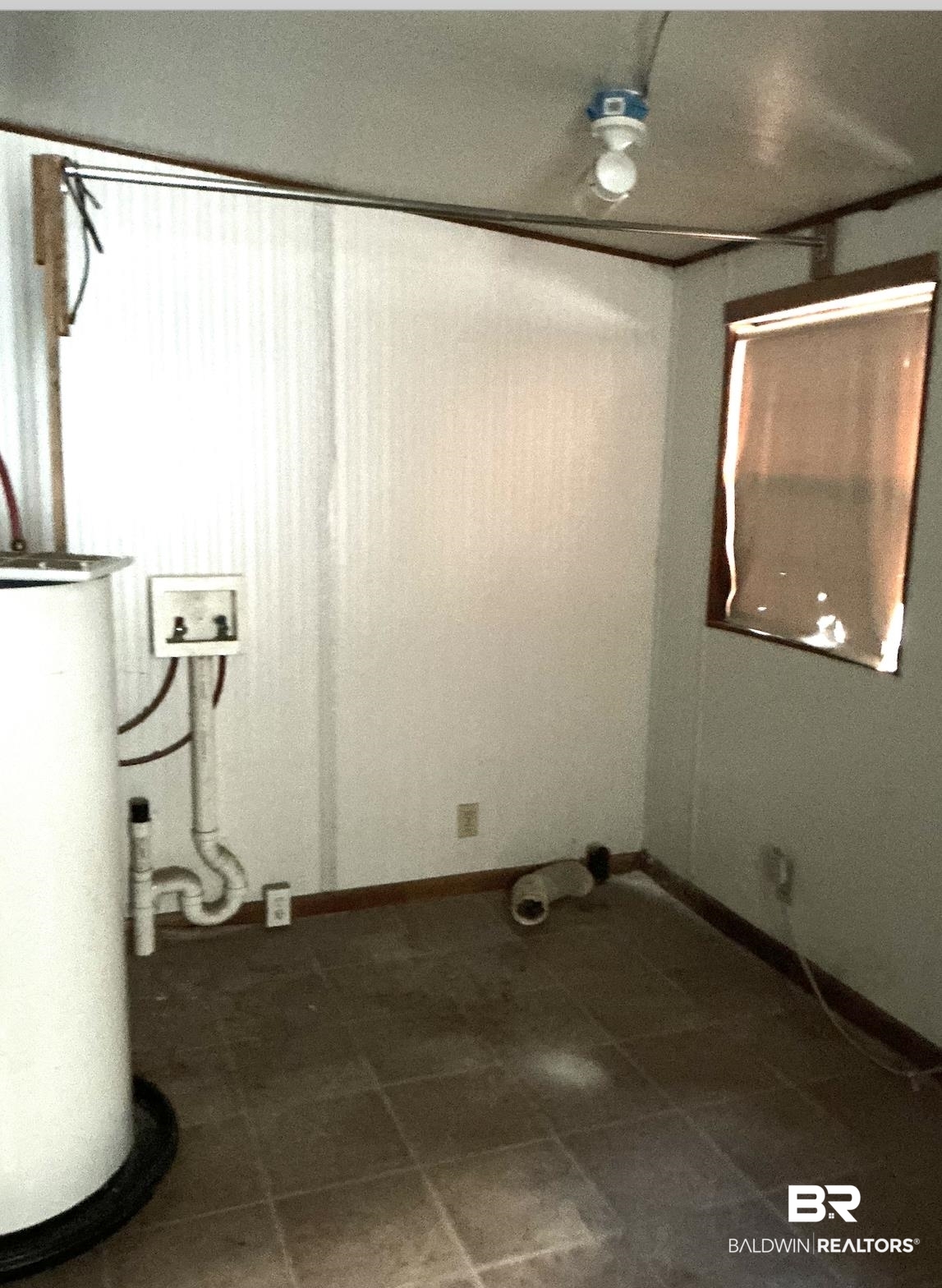 84 Horn Drive Lillian, AL 36549 - Photo 7 of 24 Washroom with hookup for a washing machine, baseboards, and tile patterned flooring