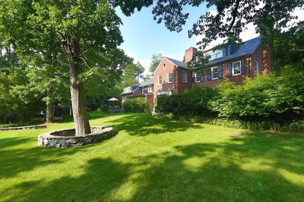 11 Laurel Road Brookline, MA 02467 - Photo 15 of 24 a front view of a house with a yard