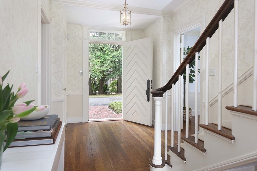 11 Laurel Road Brookline, MA 02467 - Photo 2 of 24 a view of entryway with wooden floor and stairs