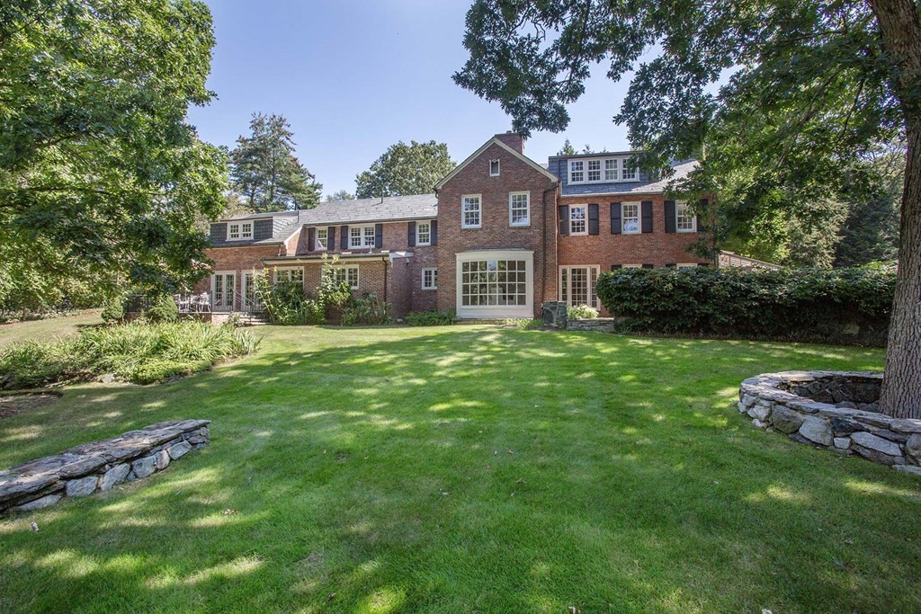 11 Laurel Road Brookline, MA 02467 - Photo 24 of 24 a front view of a house with a garden
