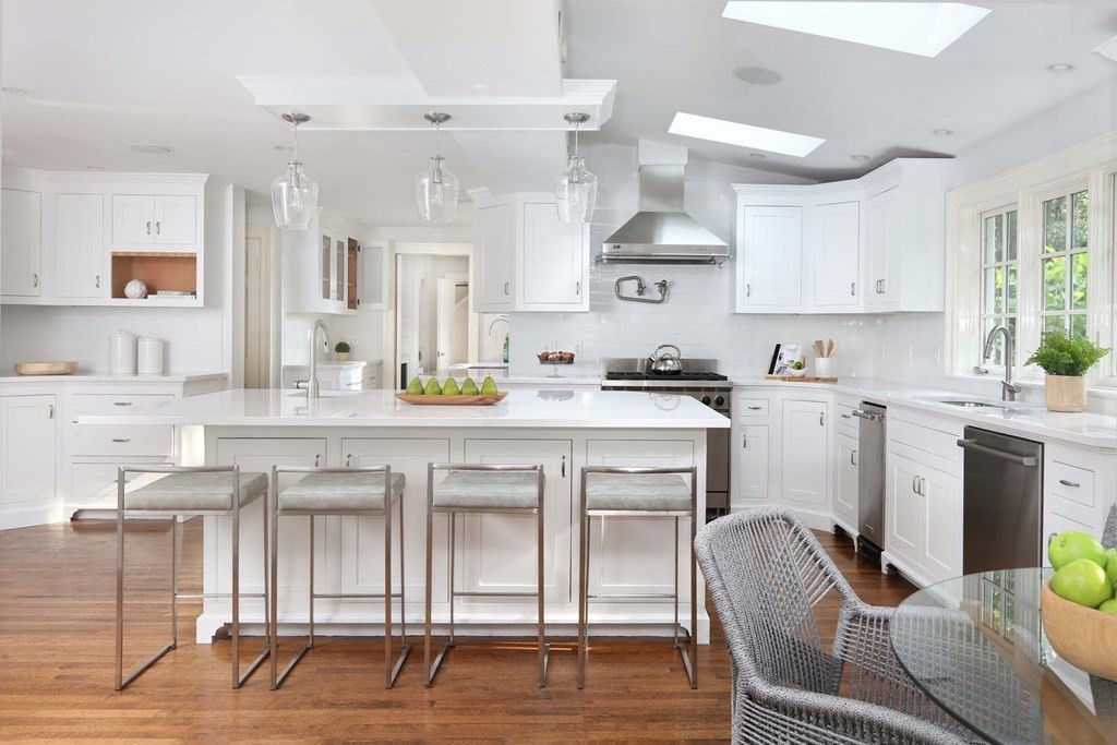 11 Laurel Road Brookline, MA 02467 - Photo 5 of 24 a kitchen with a sink cabinets and window