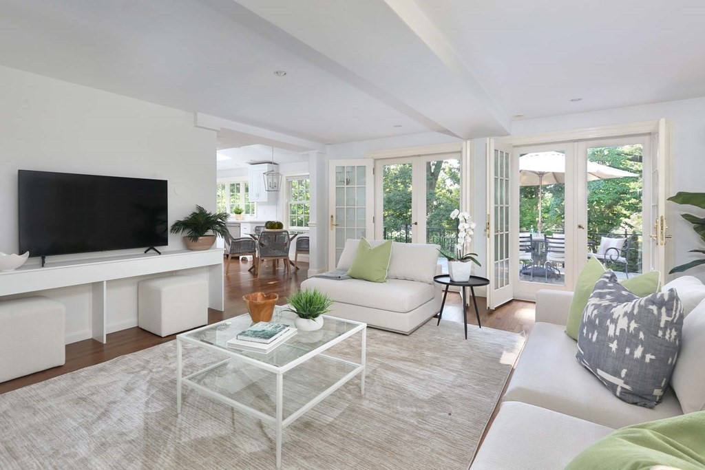 11 Laurel Road Brookline, MA 02467 - Photo 7 of 24 a living room with furniture and a flat screen tv