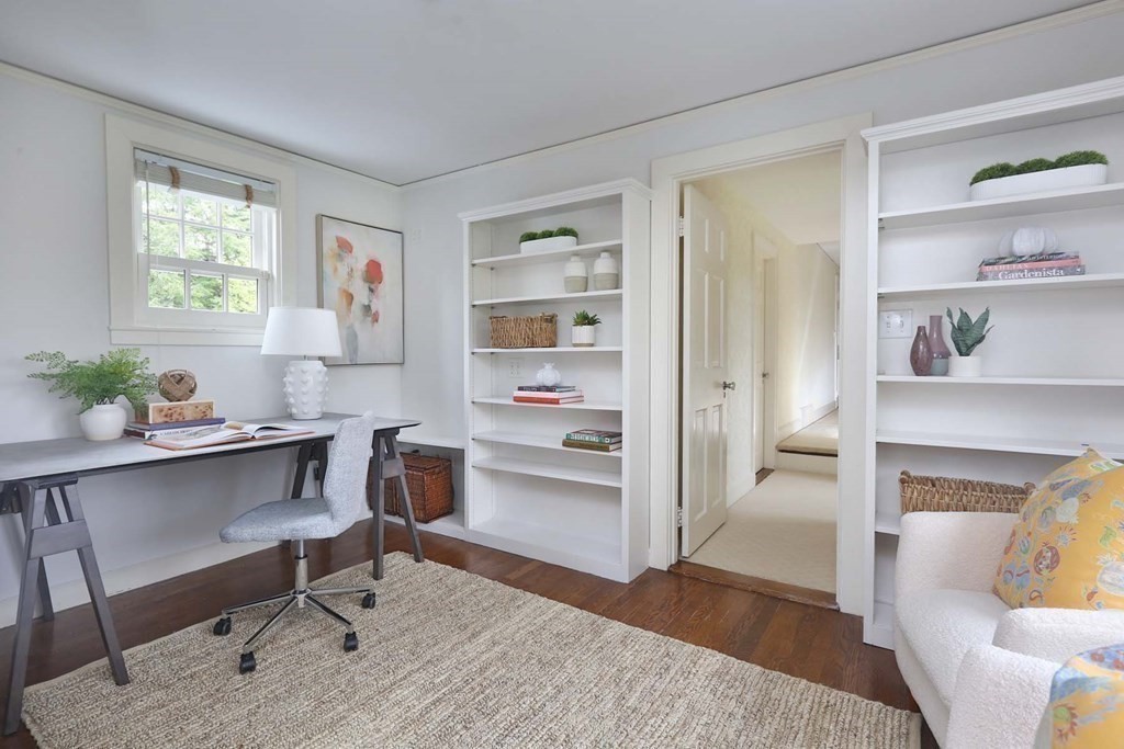 11 Laurel Road Brookline, MA 02467 - Photo 9 of 24 a living room with furniture a fireplace and a window