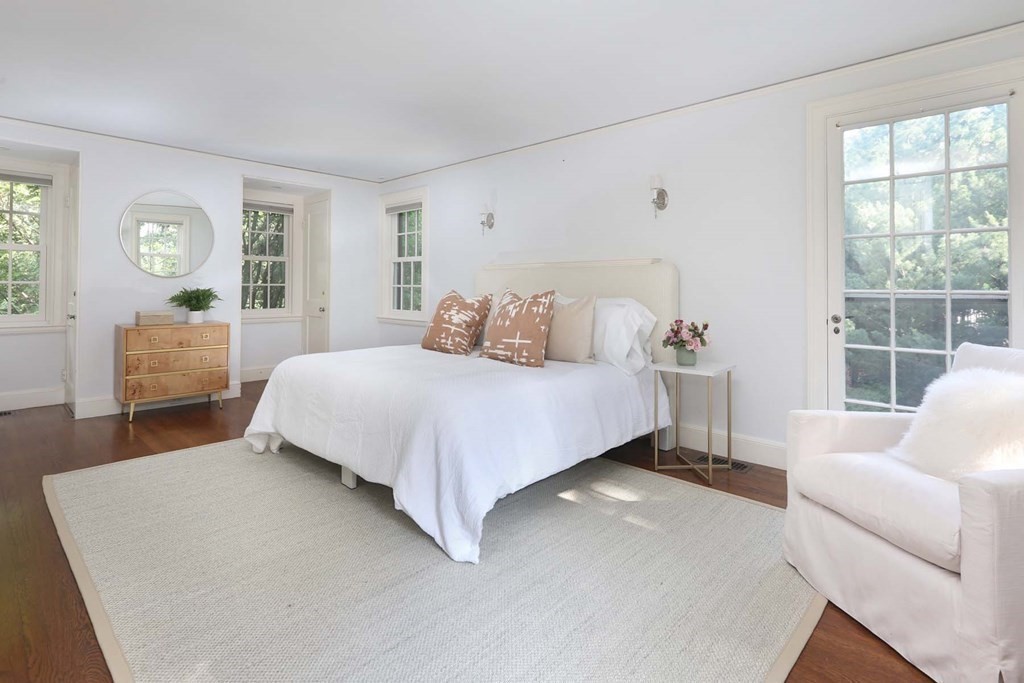 11 Laurel Road Brookline, MA 02467 - Photo 10 of 24 a bedroom with a large bed and windows