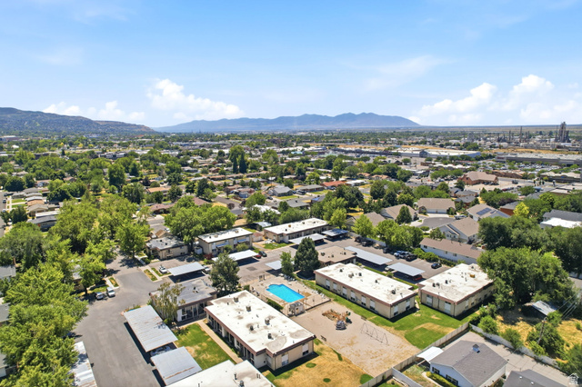 314 West Center Street, Unit F102 Bountiful, UT 84010 - Photo 27 of 29 Expansive aerial perspective showcasing a residential neighborhood with surrounding mountains
