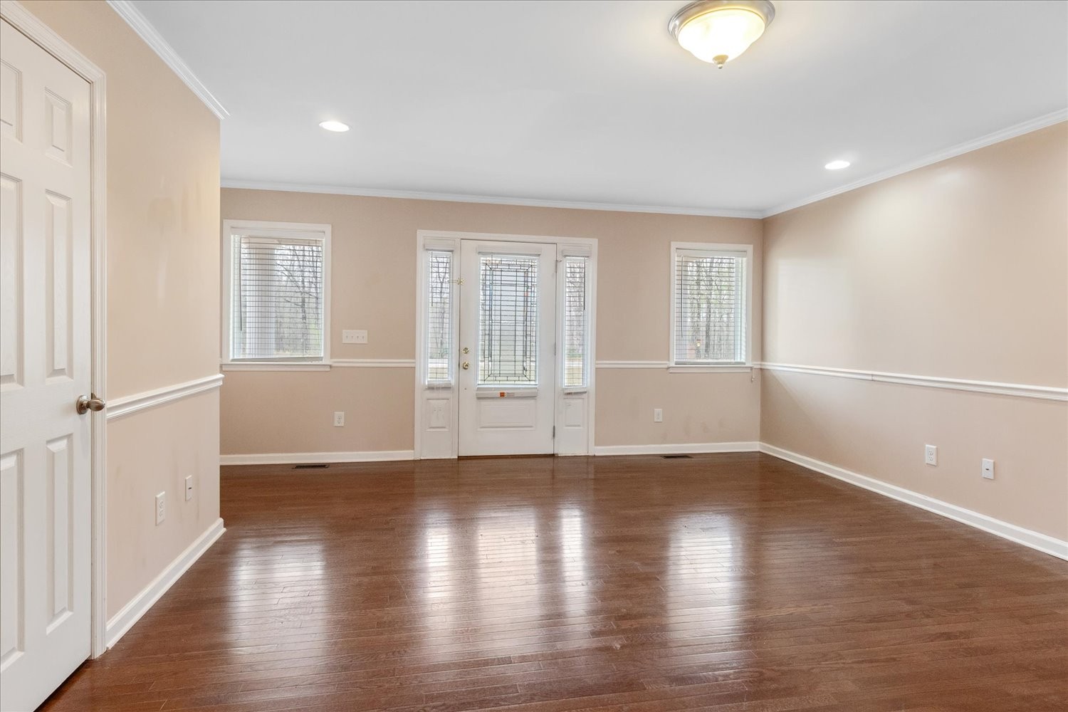732 Tiger Bennett Road Hampshire, TN 38461 - Photo 12 of 35 an empty room with wooden floor and windows